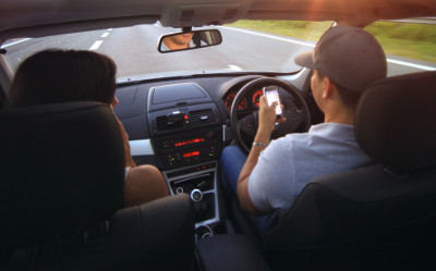 Driver using mobile at the wheel